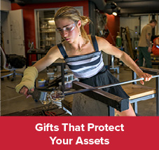 Student working on a glass blowing project. Gifts That Protect Your Assets 